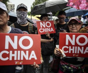 epa07879307 Protesters carry banners and shout slogans as they march in the street to show their support in the on-going protest in Hong Kong, in Taipei, Taiwan, 29 September 2019. Hong Kong has entered its fourth month of mass protests, originally triggered by a now suspended extradition bill to mainland China, that have turned into a wider pro-democracy movement.  EPA/RITCHIE B. TONGO
