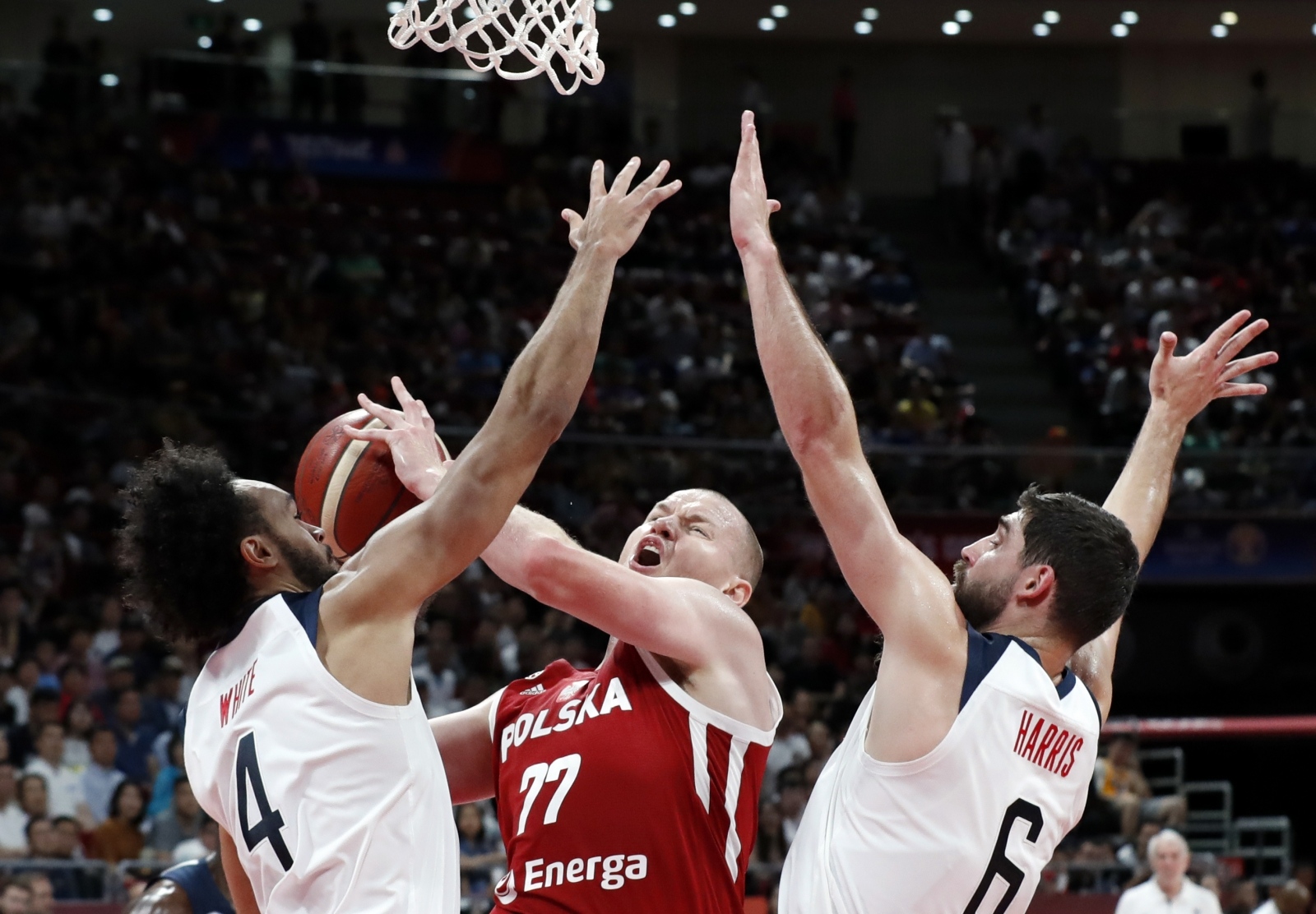 Basketball - FIBA World Cup - Classification Games 7-8 - United States v Poland Basketball - FIBA World Cup - Classification Games 7-8 - United States v Poland - Wukesong Sport Arena, Beijing, China - September 14, 2019  Poland's Damian Kulig in action with Derrick White and Joe Harris of the U.S. REUTERS/Kim Kyung-Hoon KIM KYUNG-HOON