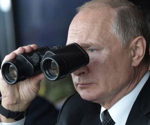 epa07855568 Russian President Vladimir Putin looks through binoculars as he watches  the main phase of the Center 2019 strategic military exercise at the Donguz test ground  outside Orenburg, Russia, 20 September 2019. The Center 2019 strategic command post exercise is held from 16 to 21 September on six training grounds of Russia and Kazakhstan. About 128 thousand military servicemen of Russia, China, Pakistan, Kyrgyzstan, Kazakhstan, India, Tajikistan and Uzbekistan, more than 20 thousand units of weapons, about 600 aircrafts and 15 war ships take part in the exercises.  EPA/ALEXEY NIKOLSKY/SPUTNIK/KREMLIN / POOL MANDATORY CREDIT