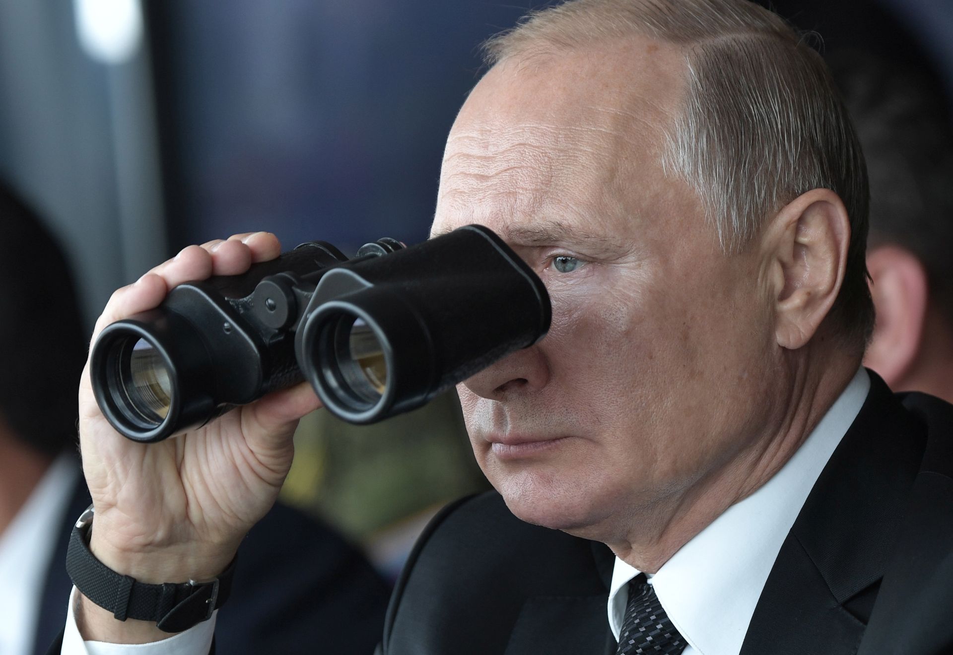 epa07855568 Russian President Vladimir Putin looks through binoculars as he watches  the main phase of the Center 2019 strategic military exercise at the Donguz test ground  outside Orenburg, Russia, 20 September 2019. The Center 2019 strategic command post exercise is held from 16 to 21 September on six training grounds of Russia and Kazakhstan. About 128 thousand military servicemen of Russia, China, Pakistan, Kyrgyzstan, Kazakhstan, India, Tajikistan and Uzbekistan, more than 20 thousand units of weapons, about 600 aircrafts and 15 war ships take part in the exercises.  EPA/ALEXEY NIKOLSKY/SPUTNIK/KREMLIN / POOL MANDATORY CREDIT