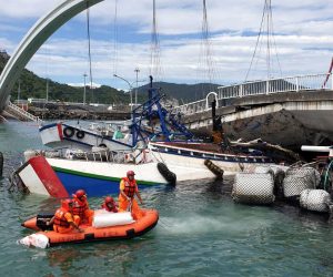 epa07884120 A handout photo made available by Taiwan Coast Guard Administration shows rescuers at the scene of the collapsed Nanfangao Bridge in Nanfangao, Yilan County, northeastern Taiwan, 01 October 2019. According to media reports, the collapse occured soon after an oil tanker crossed on to the bridge. The structural failure caused the tanker to fall into the waterway and ignite. Civilian and military rescuers have rescued 10 people, including oil the tanker's driver.  EPA/TAIWAN COASTGUARD ADMINISTRATION / HANDOUT BEST QUALITY AVAILABLE HANDOUT EDITORIAL USE ONLY/NO SALES
