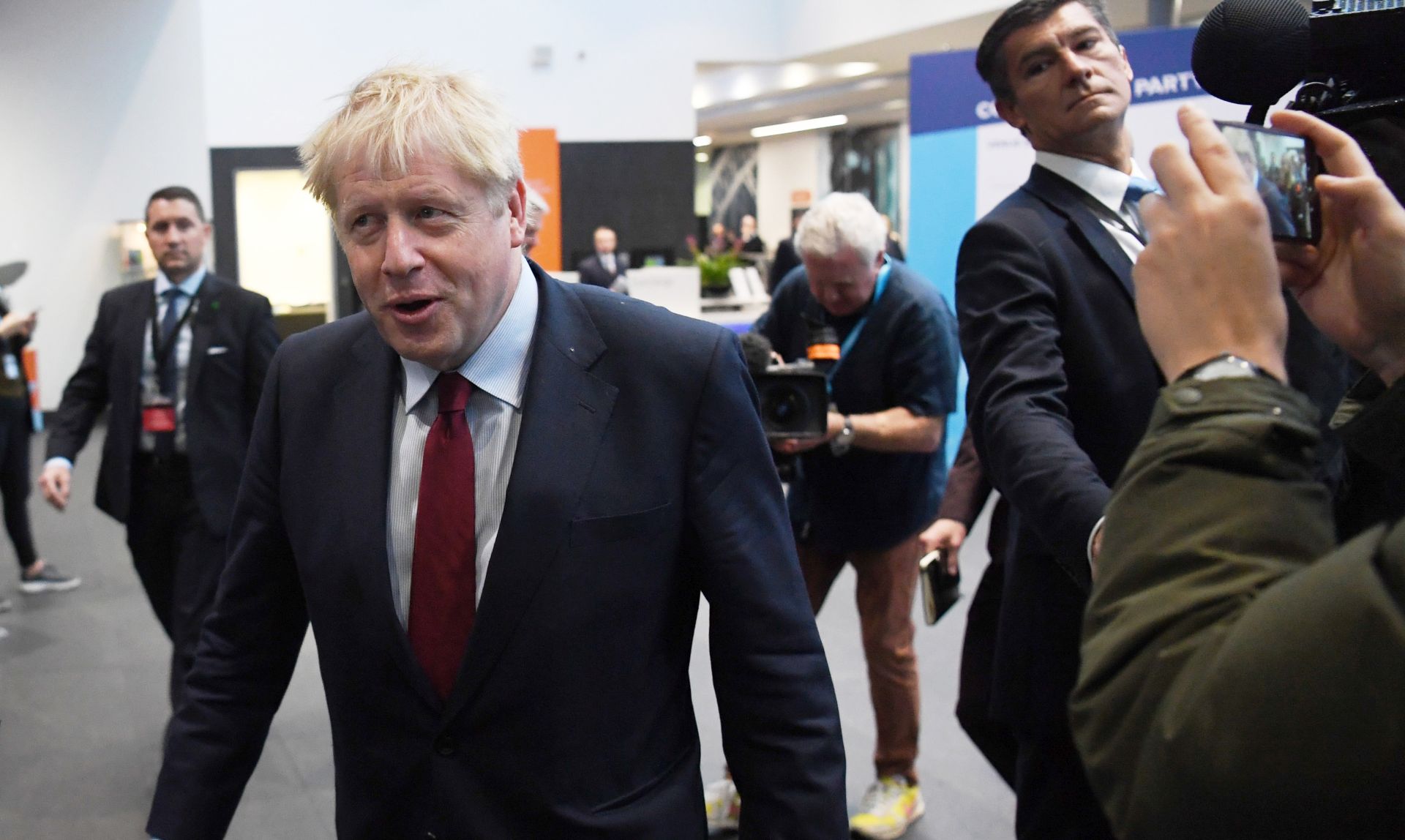 epa07884432 Britain's Prime Minister Boris Johnson arrives for media interviews at the Conservative Party Conference in Manchester, Britain, 01 October 2019. The Conservative Party Conference runs from 29 September to 02 October 2019.  EPA/NEIL HALL
