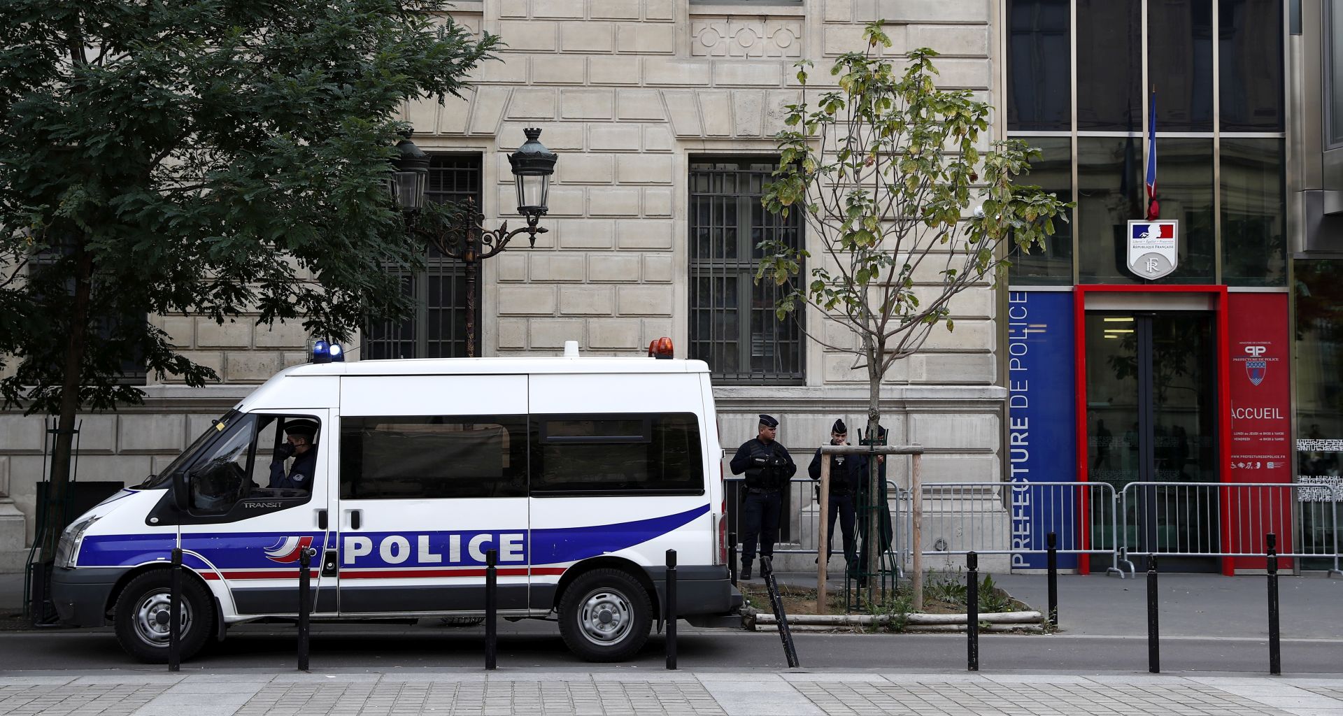 epa07891533 French police and security forces establish a security perimeter near the police headquarters in Paris, France, 03 October 2019. According to reports, a man was killed after attacking officers with a knife. Two officers were injured in the incident.  EPA/IAN LANGSDON
