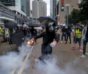 epa07900476 A protester prepares to throw a flaming projectile during an Anti-ERO (Emergency Regulations Ordinance) demonstration against a newly imposed law banning face masks in public in Hong Kong, China, 06 October 2019. Anti-government protesters took to the streets against the government's use of emergency powers to ban face masks in public in a bid to end the city's protests. Hong Kong has been gripped by mass demonstrations since June over a now-withdrawn extradition bill, which have since morphed into a wider anti-government movement.  EPA/FAZRY ISMAIL