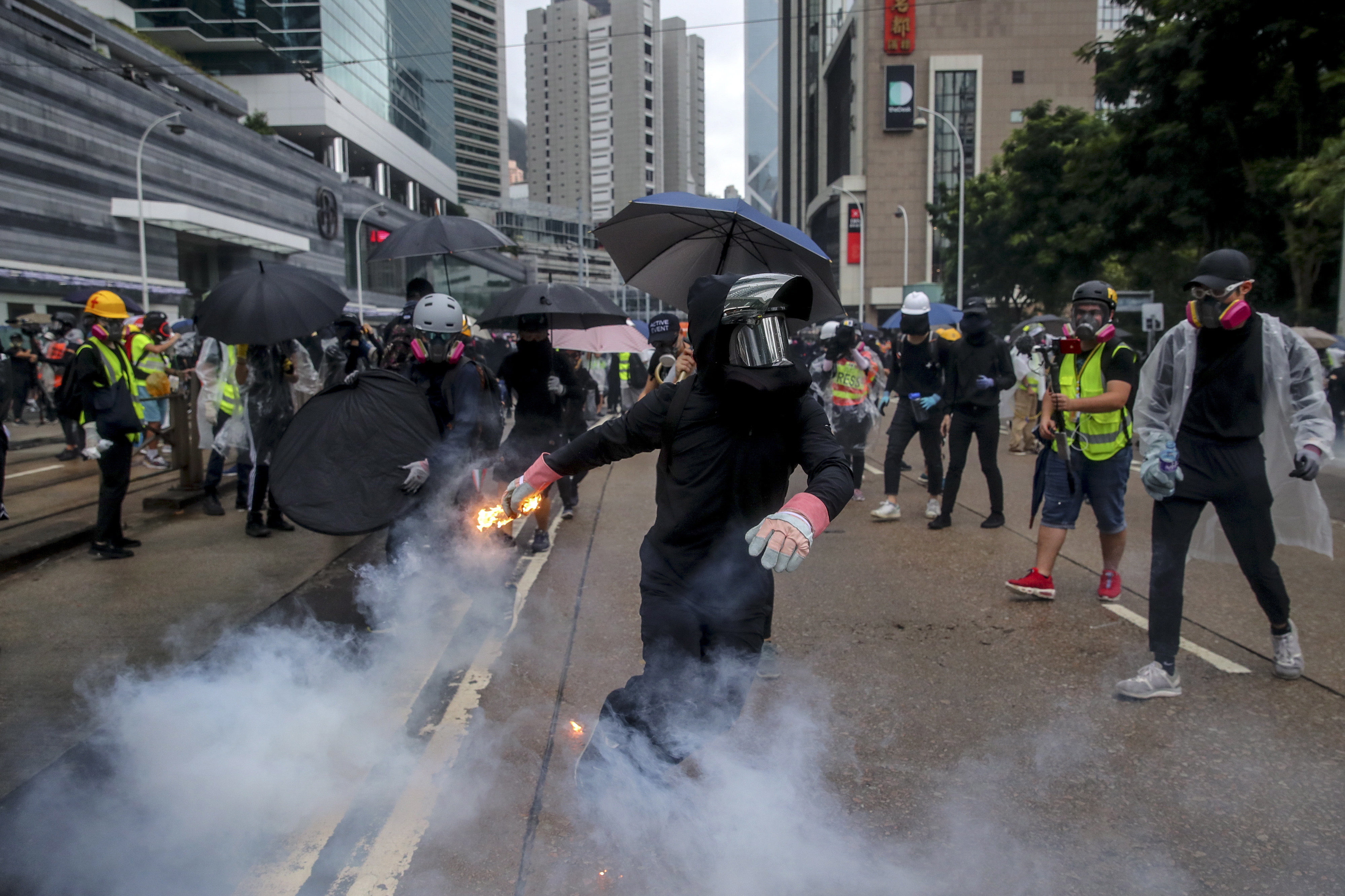 epa07900476 A protester prepares to throw a flaming projectile during an Anti-ERO (Emergency Regulations Ordinance) demonstration against a newly imposed law banning face masks in public in Hong Kong, China, 06 October 2019. Anti-government protesters took to the streets against the government's use of emergency powers to ban face masks in public in a bid to end the city's protests. Hong Kong has been gripped by mass demonstrations since June over a now-withdrawn extradition bill, which have since morphed into a wider anti-government movement.  EPA/FAZRY ISMAIL