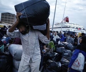 epa07902852 Migrants disembark from the ferry 'Nissos Samos' upon their arrival from Lesvos island to the port of Piraeus, Greece, 07 October 2019. The ferry arrived in Piraeus carrying 453 refugees and migrants from Moria, Lesvos and 13 from Chios Island, from the so-called vulnerable groups asking for asylum, who will be transferred to the village of Vagiohori, close to lake Volvi, in central Macedonia. The Moria reception and identification centre currently hosts 13,300 people, 1,000 of which are unaccompanied minors.  EPA/YANNIS KOLESIDIS