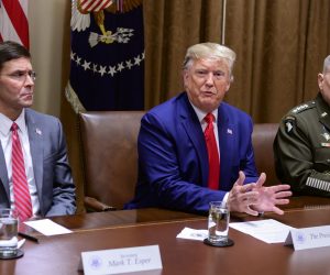 epa07904565 US President Donald J. Trump answers a reporter's question as he participates in a briefing with senior military leaders in the Cabinet Room of the White House in Washington, DC, USA, on 07 October 2019.  At left is United States Secretary of Defense Dr. Mark T. Esper, left, and at right is United States Army General Mark A. Milley, Chairman of the Joint Chiefs of Staff.  EPA/Ron Sachs / POOL