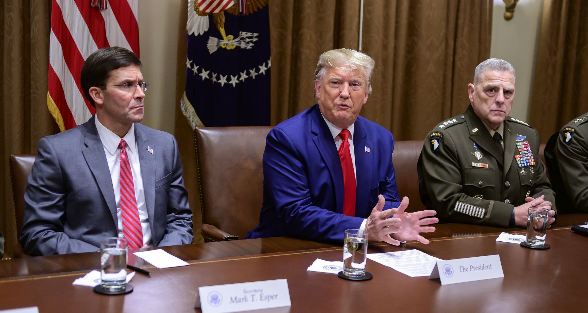 epa07904565 US President Donald J. Trump answers a reporter's question as he participates in a briefing with senior military leaders in the Cabinet Room of the White House in Washington, DC, USA, on 07 October 2019.  At left is United States Secretary of Defense Dr. Mark T. Esper, left, and at right is United States Army General Mark A. Milley, Chairman of the Joint Chiefs of Staff.  EPA/Ron Sachs / POOL