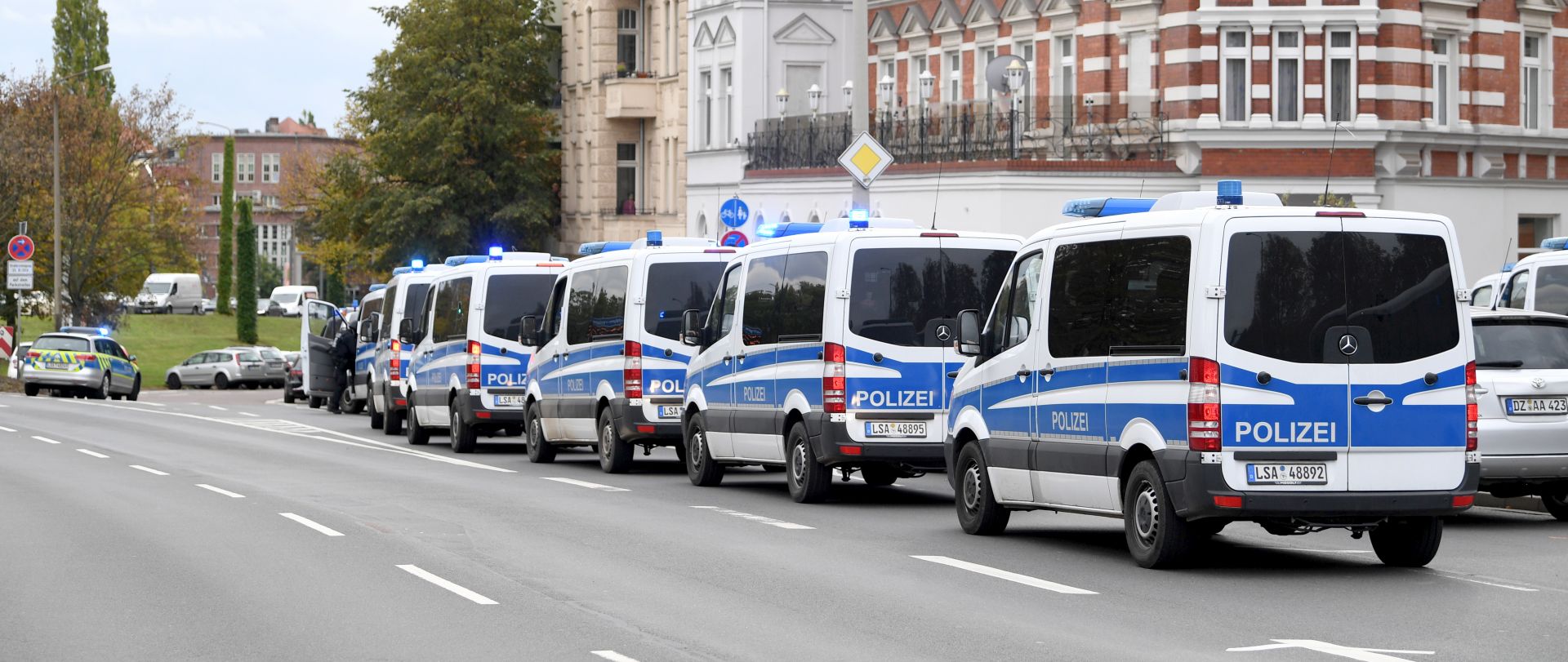epa07907593 Police cars stand near a Synagogue after a shooting in Halle, Germany, 09 October 2019. According to the police two people were killed in shootings in front of a Synagogue and a Kebab shop in the Paulus district of Halle in the East German federal state of Saxony-Anhalt. Police stated a suspect is already in arrest. Media report the mayor of Halle speaks of an amok situation.  EPA/FILIP SINGER
