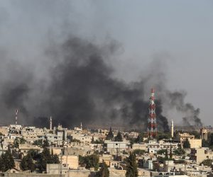 epa07910278 A picture taken from Turkish territory shows smoke rising from targets inside Syria during bombardment by Turkish forces at Ras al-Ein town, in Ceylanpinar, in Sanliurfa, Turkey 10 October 2019. Turkey has launched an offensive targeting Kurdish forces in north-eastern Syria, days after the US withdrew troops from the area.  EPA/SEDAT SUNA