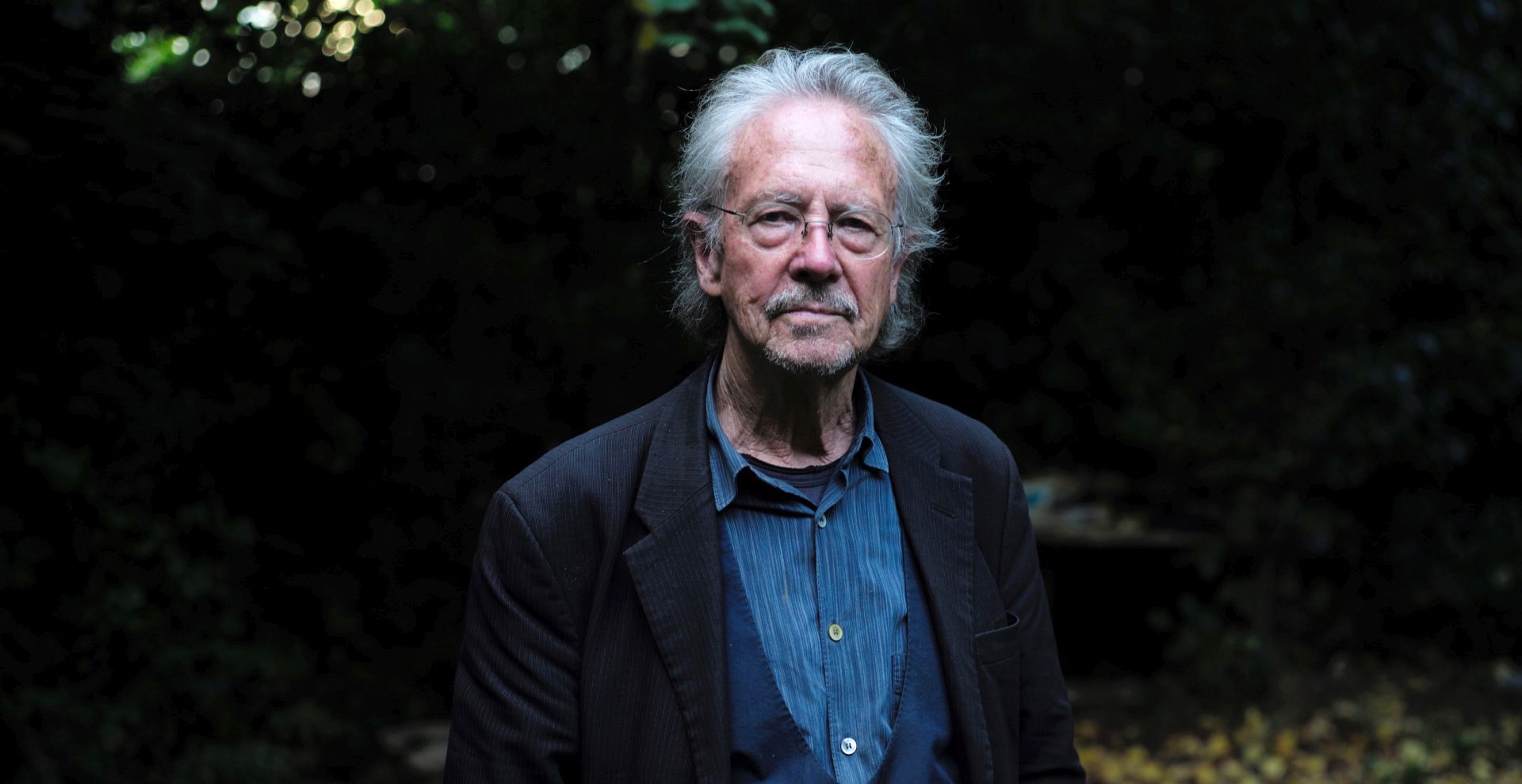 epa07910653 Austrian writer Peter Handke poses for photographs at his home in Chaville, near Paris, France, 10 October 2019. The Nobel Prize in Literature for 2019 is awarded to Peter Handke, the Swedish Academy announced on 10 October 2019.  EPA/JULIEN DE ROSA