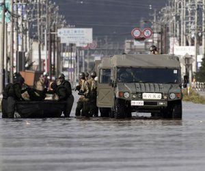 epa07917330 Japan's Self-Defense Force's vehicles and personnel prepare for a rescue operation at a  typhoon Hagibis flooded area in Nagano, Nagano Prefecture, central Japan, 13 October 2019. According to media reports, Tyhoon Hagibis has so far killed at least 26 people and injured more than 170, with some 18 still missing. The strongest typhoon of this season forced to suspend many railway services all over the country as well as cancelling about 1,600 domestic and international flights.  EPA/KIMIMASA MAYAMA