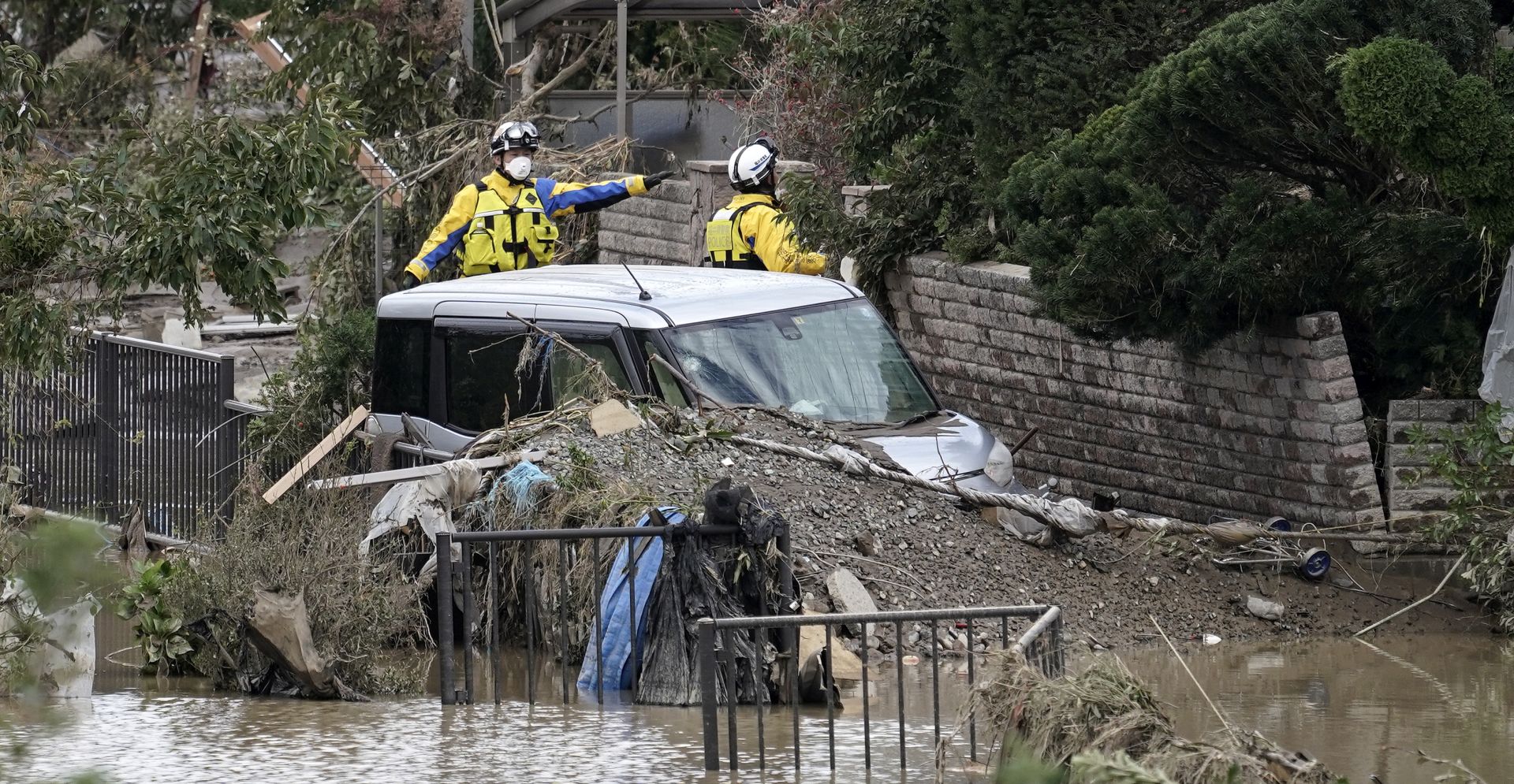 epa07919336 Police rescuers search for missing people in the Hoyasu area, which is flooded and devastated by Typhoon Hagibis, in Nagano, Nagano Prefecture, central Japan, 14 October 2019. Tyhoon Hagibis killed 40 people, injured more than 180 people and leave 16 others missing, Japan public television reported. The strongest typhoon this season forced the suspension of many Japan railway services all over the country and cancelled about 1,600 domestic and international flights. Japan's Meteorological Agency issued evacuation order to more than 4,000,000 people, according to news reports.  EPA/KIMIMASA MAYAMA
