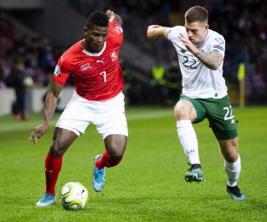 epa07923490 Switzerland's forward Breel Embolo, left, fight for the ball with Ireland's forward James Collins, right, during the UEFA Euro 2020 qualifying Group D soccer match between Switzerland and the Republic of Ireland, at the Stade de Geneve, in Geneva, Switzerland, 15 October 2019.  EPA/JEAN-CHRISTOPHE BOTT