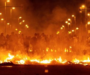 epa07923746 Protesters create a burning barricade during a rally against the sentence ruled by Supreme Court on 'proces' trial' in downtown Barcelona, Catalonia, Spain, 15 October 2019. Demonstrators are blocking some roads in Catalonia against the court's decision.The Spanish Supreme Court on 14 October 2019 issued a fresh European arrest warrant for the deposed former president following its sentencing of former Catalan Vice President Oriol Junqueras to 13 years in jail for sedition and misuse of public funds. Several other political leaders were also handed multi-year prison sentences for their roles in holding a failed independence vote in 2017.  EPA/ENRIC FONTCUBERTA