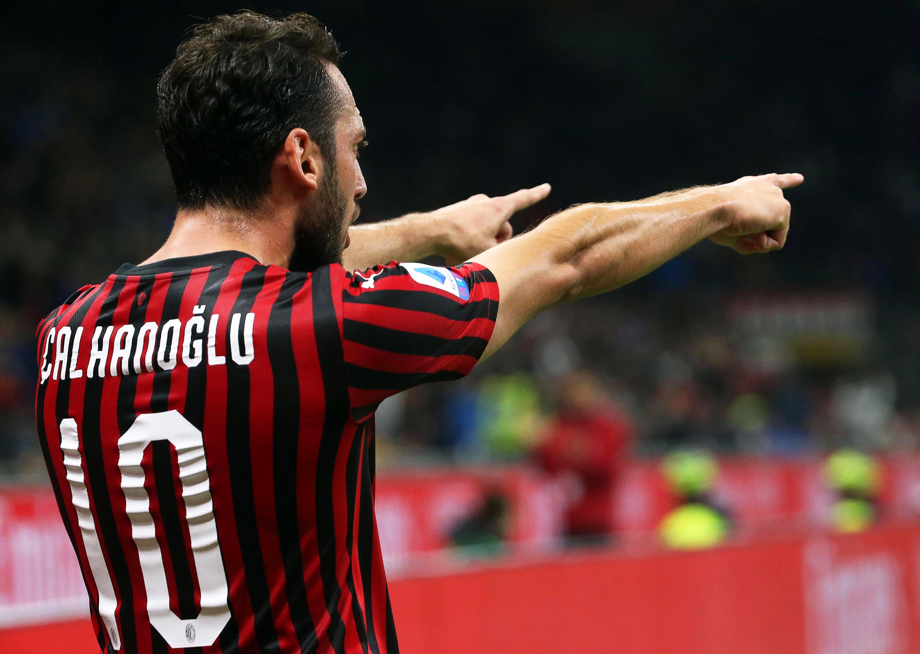 epa07937465 Milan's Hakan Calhanoglu celebrates after scoring the 1-0 lead during the Italian Serie A soccer match between AC Milan and US Lecce at Giuseppe Meazza stadium in Milan, Italy, 20 October 2019.  cc
