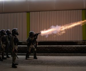 epa07938998 Police fire tear gas during a rally marking the third month anniversary of alleged triads members attacking protesters and residents in Yuen Long, New Territories, Hong Kong, China, 21 October 2019. Hong Kong has witnessed several months of ongoing mass protests, originally triggered by a now withdrawn extradition bill to mainland China that have turned into a wider pro-democracy movement.  EPA/JEROME FAVRE