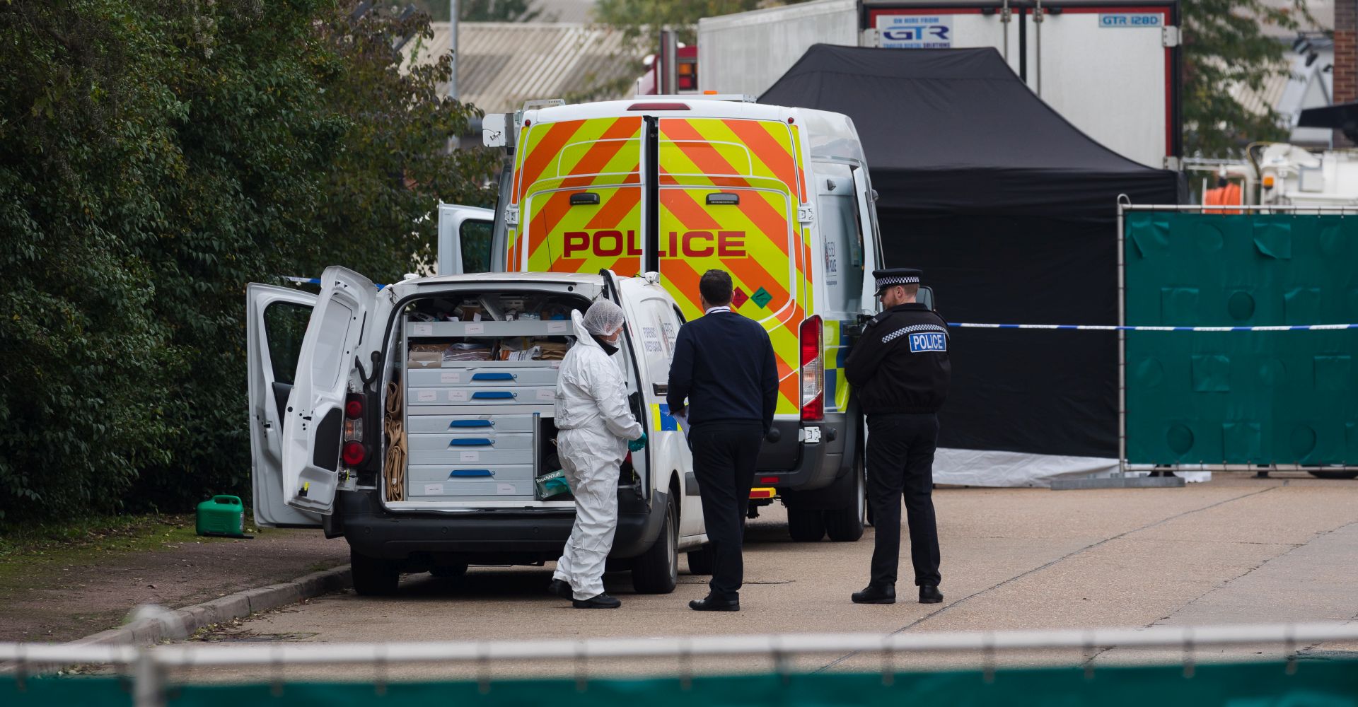 epa07942769 Police and forensic officers investigate at the scene in Waterglade Industrial Park in Grays, Essex, Britain, 23 October 2019. A total of 39 bodies were discovered inside a lorry container in the early hours of this morning, and pronounced dead at the scene.  EPA/VICKIE FLORES