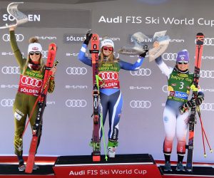 epa07950973 Alice Robinson (C) of New Zealand celebrates on the podium after winning the women's Giant Slalom race of the FIS Alpine Skiing World Cup season opener in Soelden, Austria, 26 October 2019. Robinson won ahead of second placed Mikaela Shiffrin (L) of the USA and third placed Tessa Worley (R) of France.  EPA/CHRISTIAN BRUNA
