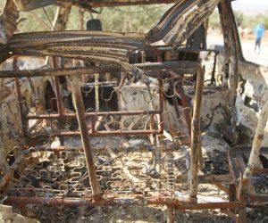 epa07955646 A of a burned-out vehicle at the site that was hit by helicopter gunfire which reportedly killed nine people, including Abu Baker al-Baghdadi, the leader of IS or so-called Islamic State, near the village of Barisha, Idlib province, Syria, 27 October 2019 (issued 28 October 2019).  EPA/YAHYA NEMAH