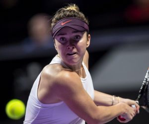epa07959729 Elina Svitolina of Ukraine in action against Simona Halep of Romania during their match at the WTA Finals 2019 tennis tournament in Shenzhen, China, 30 October 2019.  EPA/ALEX PLAVEVSKI