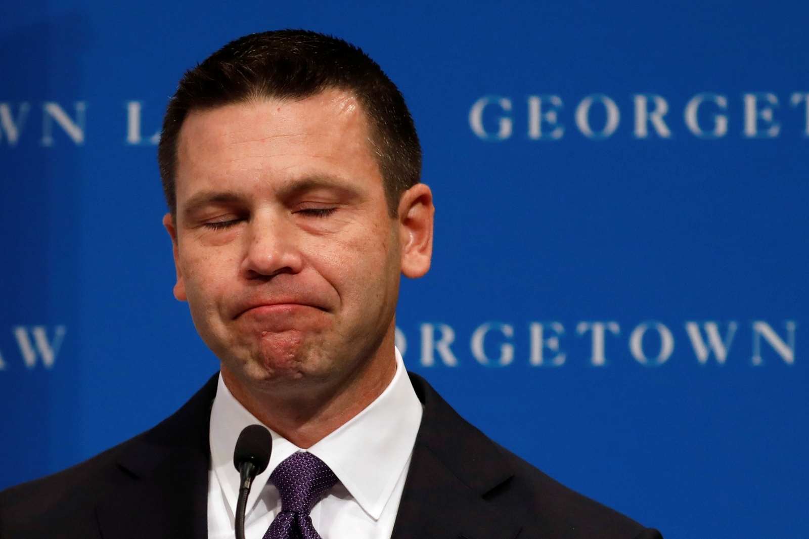 Acting DHS Secretary Kevin McAleenan attends the Migration Policy Institute annual Immigration Law and Policy Conference Acting Department of Homeland Security (DHS) Secretary Kevin McAleenan reacts while protesters interrupt his remarks at the Migration Policy Institute annual Immigration Law and Policy Conference in Washington, U.S., October 7, 2019. REUTERS/Yuri Gripas YURI GRIPAS