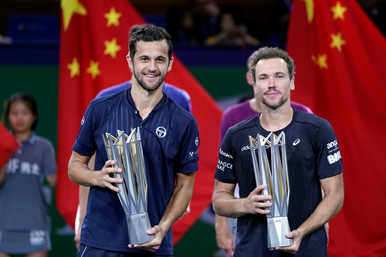 Tennis - Shanghai Masters - Men's Doubles Tennis - Shanghai Masters - Men's Doubles - Shanghai, China - October 13, 2019 - Mate Pavic of Croatia and Bruno Soares of Brazil celebrate with trophies after winning the final against Lukasz Kubot of Poland and Marcelo Melo of Brazil in the men's doubles final match. REUTERS/Aly Song ALY SONG