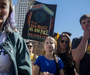 epa07965725 Greta Thunberg marches in front of Los Angeles City Hall at the Youth Climate Strike in Los Angeles, California, USA, 01 November 2019. Several hundred people gathered and marched through the streets to demand elected officials take action against the climate crisis.  EPA/CHRISTIAN MONTERROSA