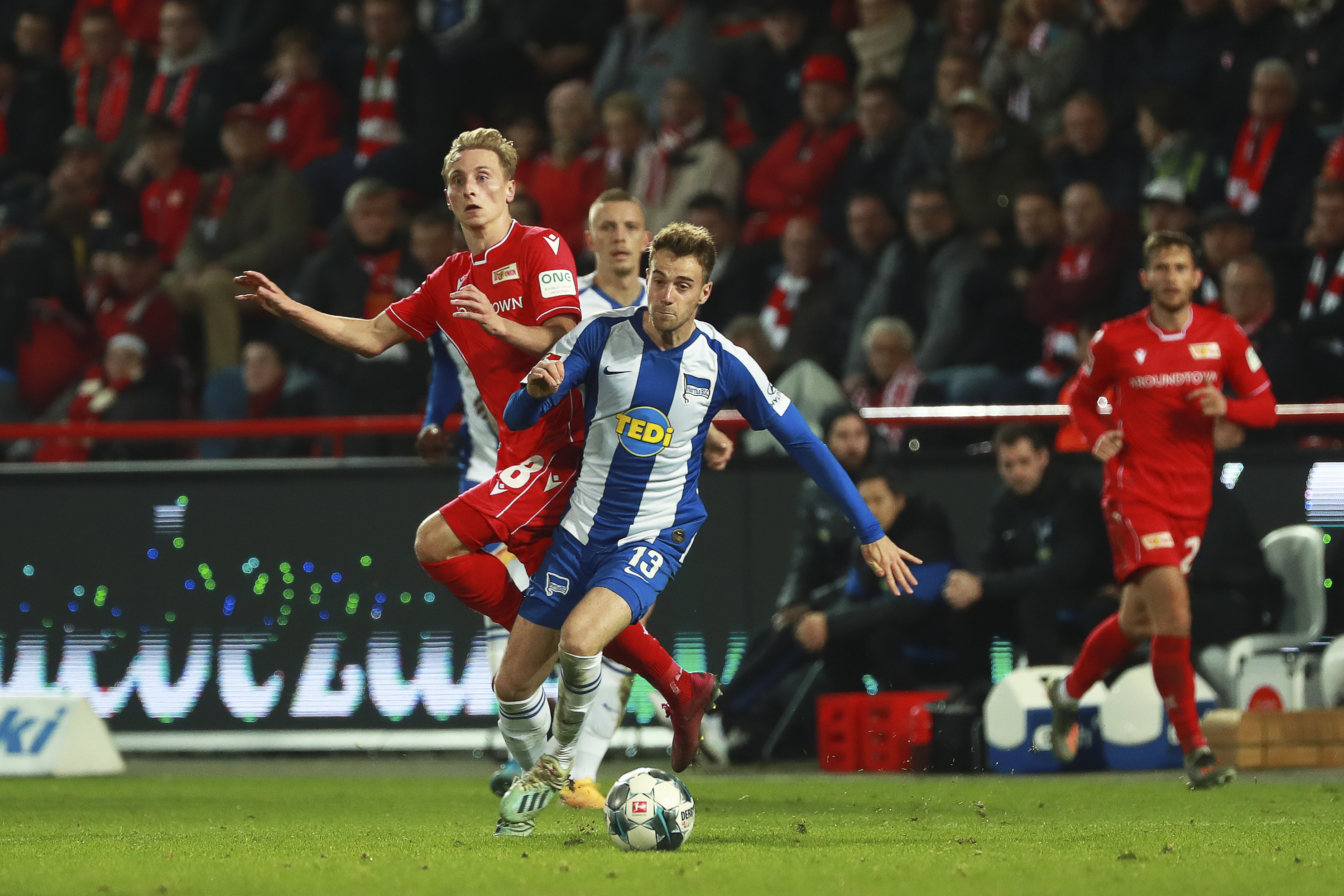 epa07967869 Union's Joshua Mees (L) and Hertha's Lukas Kluenter (C) in action during the German Bundesliga soccer match between FC Union Berlin and Hertha BSC in Berlin, Germany, 02 November 2019.  EPA/HAYOUNG JEON CONDITIONS - ATTENTION: The DFL regulations prohibit any use of photographs as image sequences and/or quasi-video.