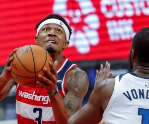 epa07968491 Washington Wizards guard Bradley Beal (L) in action against Minnesota Timberwolves forward Noah Vonleh (R) during the first half of the NBA basketball game between the Minnesota Timberwolves and the Washington Wizards at CapitalOne Arena in Washington, DC, USA, 02 November 2019.  EPA/ERIK S. LESSER SHUTTERSTOCK OUT