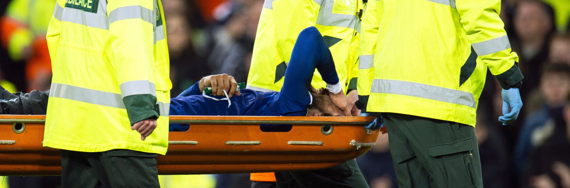 epa07970194 Everton's Andre Gomes (bottom) is stretchered off the pitch after being injured during the English Premier League soccer match between Everton FC and Tottenham Hotspur at the Goodison Park in Liverpool, Britain, 03 November 2019.  EPA/PETER POWELL EDITORIAL USE ONLY. No use with unauthorized audio, video, data, fixture lists, club/league logos or 'live' services. Online in-match use limited to 120 images, no video emulation. No use in betting, games or single club/league/player publications