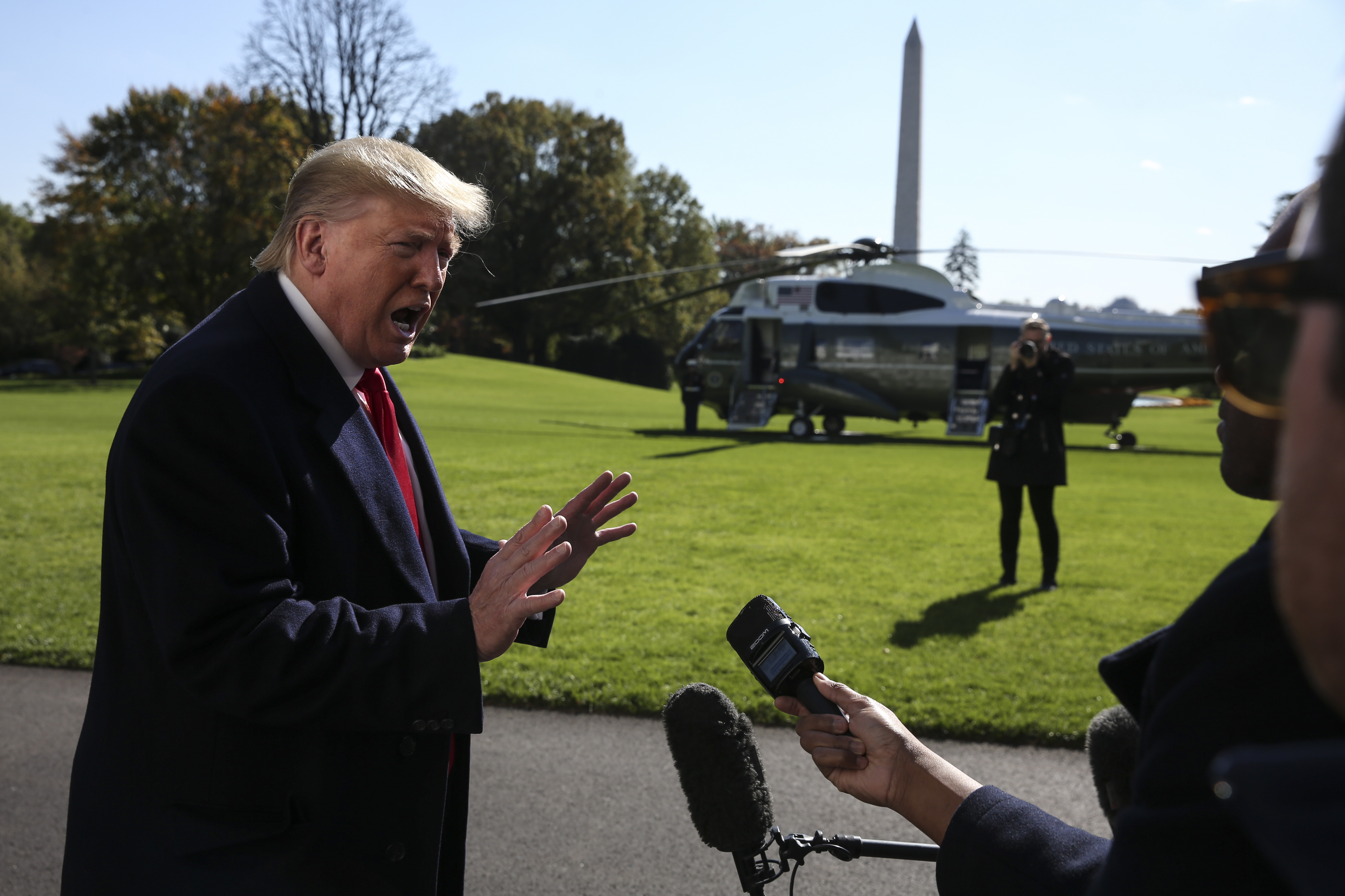 epa07970143 US President Donald J. Trump talks to members of the media on the South Lawn of the White House upon his arrival from a trip to New York, in Washington, DC, USA, 03 Novermber 2019.  EPA/Oliver Contreras / POOL