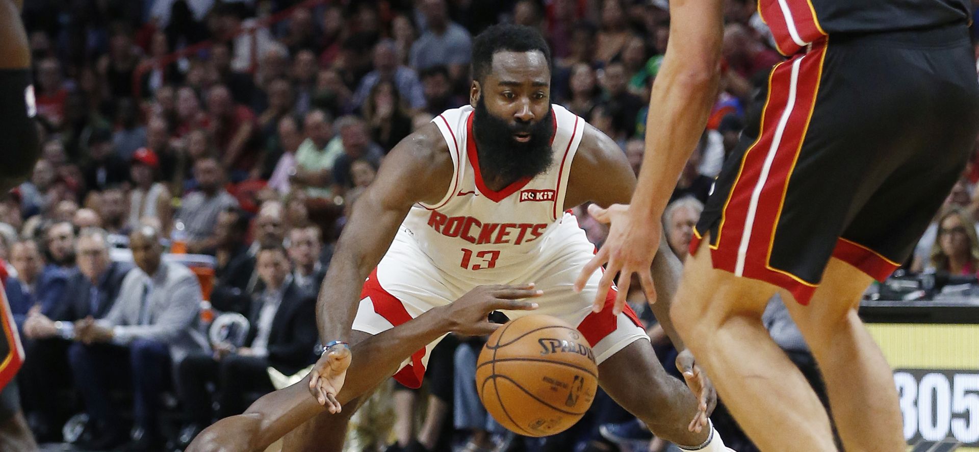 epaselect epa07970745 Houston Rockets James Harden (yop) defends Miami Heat guard Jimmy Butler (bottom) during the NBA basketball game between the Miami Heat and the Houston Rockets at the AmericanAirlines Arena in Miami, Florida, USA 03 November 2019.  EPA/RHONA WISE  SHUTTERSTOCK OUT