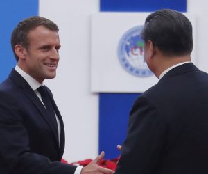 epa07973060 Chinese President Xi Jinping (R) shakes hands with French President Emmanuel Macron (L) after he delivered a speech during the opening ceremony of the second China International Import Expo at the National Exhibition and Convention Center in Shanghai, China, 05 November 2019. The Expo will be held in Shanghai from 05 November to 10 November 2019.  EPA/WU HONG