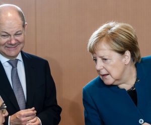 epa07975789 German Chancellor Angela Merkel (R) and German Foreign Minister Heiko Maas (L) talk next to German Minister of Finance Olaf Scholz (2-L) during the beginning of the weekly meeting of the German Federal cabinet at the Chancellery in Berlin, Germany, 06 November 2019. During the 47th cabinet meeting, the ministers and the Chancellor are expected to discuss, among other topics, the inventory of the implementation of the coalition contract.  EPA/CLEMENS BILAN