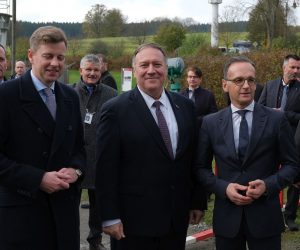 epa07978463 U.S. Secretary of State Mike Pompeo (C) and German Foreign Minister Heiko Maas (R) stand at a still-standing portion of the former fortified border between East Germany and West Germany while touring the memorial site there on November 7, 2019 in Moedlareuth, Germany. Pompeo is in Germany ahead of the November 9 30th anniversary of the fall of the Berlin Wall, which led to the collapse of the communist East German government in 1989 and the eventual reunification of East and West Germany. Pompeo served in the U.S. armed forces and was a tank commander stationed in West Germany. In Moedlareuth the border ran directly through the village.  EPA/Sean Gallup / POOL