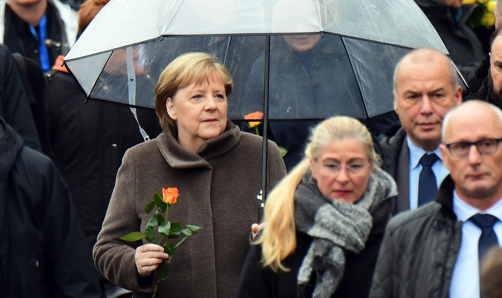 epa07982896 German Chancellor Angela Merkel (C) arrives for the celebrations of the 30th anniversary of the fall of the Berlin Wall at the Berlin Wall Memorial site along Bernauer street in Berlin, Germany, 09 November 2019. The fall of the Berlin Wall led to the collapse of the communist East German GDR government in 1989 and the eventual reunification of East and West Germany.  EPA/CLEMENS BILAN