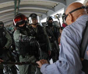 epa07985584 Riot police argue with elderly protesters on a pedestrian bridge near Citywalk mall during a rally in Hong Kong, China, 10 November 2019. According to media reports, protesters vandalized a subway station and a shopping mall. Hong Kong is in its fifth month of mass protests, which were originally triggered by a now withdrawn extradition bill, and have since turned into a wider pro-democracy movement.  EPA/JEROME FAVRE