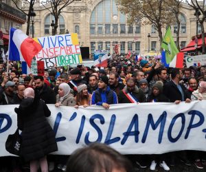 epa07986133 People and members of anti-racism associations gather to protest against Islamophobia at the Gare du Nord in Paris, France, 10 November 2019. Protesters gathered to protest against the anti-Muslim acts in France. The demonstration was called by the Collective Contre l’Islamophobie in France (CCIF), following an attack against a mosque in Bayonne on 28 October where an attacker killed two people that tried to stop him from setting a fire at the doors of the mosque.  EPA/CHRISTOPHE PETIT TESSON