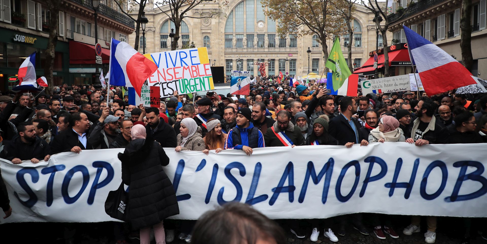 epa07986133 People and members of anti-racism associations gather to protest against Islamophobia at the Gare du Nord in Paris, France, 10 November 2019. Protesters gathered to protest against the anti-Muslim acts in France. The demonstration was called by the Collective Contre l’Islamophobie in France (CCIF), following an attack against a mosque in Bayonne on 28 October where an attacker killed two people that tried to stop him from setting a fire at the doors of the mosque.  EPA/CHRISTOPHE PETIT TESSON