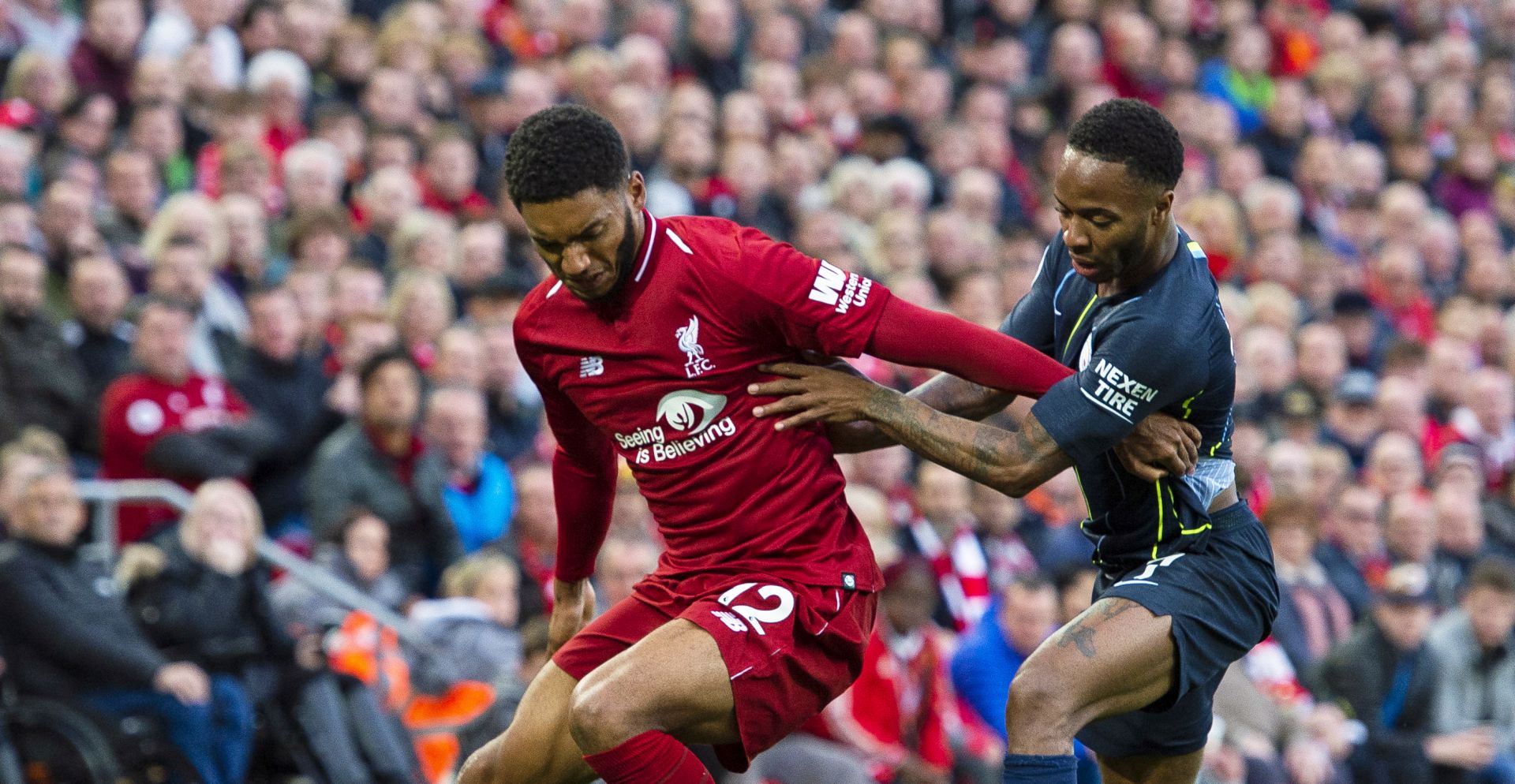 epa07990905 (FILE) - Liverpool's Joe Gomez (L) in action against Manchester City's Raheem Sterling (R) during the English Premier League soccer match between Liverpool FC and Manchester City at Anfield in Liverpool, Britain, 07 October 2018 (re-issued 12 November 2019). The England national soccer team dropped Raheem Sterling following a clash with teammate Joe Gomez at the England camp, British media reports claimed on 12 November 2019.  EPA/PETER POWELL EDITORIAL USE ONLY. No use with unauthorized audio, video, data, fixture lists, club/league logos or 'live' services. Online in-match use limited to 75 images, no video emulation. No use in betting, games or single club/league/player publications *** Local Caption *** 54684121
