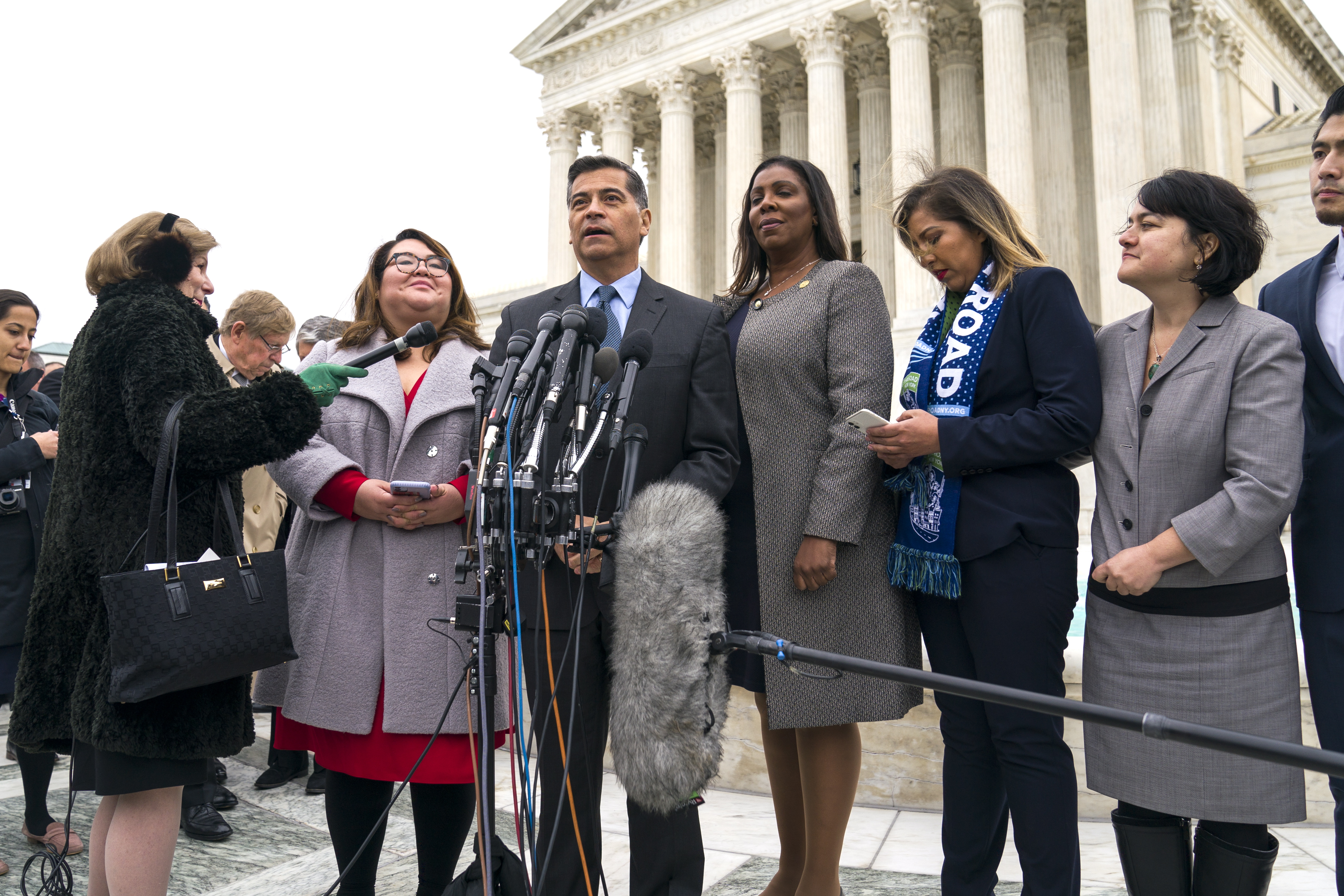 epa07991468 Attorney General of California Xavier Becerra (C-L) and Attorney General of New York Letitia James (C-R) gather with plaintiffs of the DACA (Deferred Action for Childhood Arrivals) case outside the US Supreme Court after the justices heard oral arguments on whether the Department of Homeland Security's bid to bring an end to the DACA policy is lawful in Washington, DC, USA, 12 November 2019. The Obama-era program allows more than 700,000 immigrants who came here as children to remain in the country legally.  EPA/JIM LO SCALZO