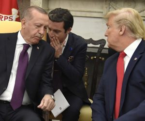 epa07993655 President Donald Trump (R) leans in as a translator speaks to Turkish President Recep Tayyip Erdogan in the Oval Office of the White House, Wednesday, November 13, 2019, Washington, DC, USA, 13 November 2019. The leaders are expected to discuss security issues, trade, NATO and Turkey's incurson into Syria.  EPA/MIKE THEILER / POOL