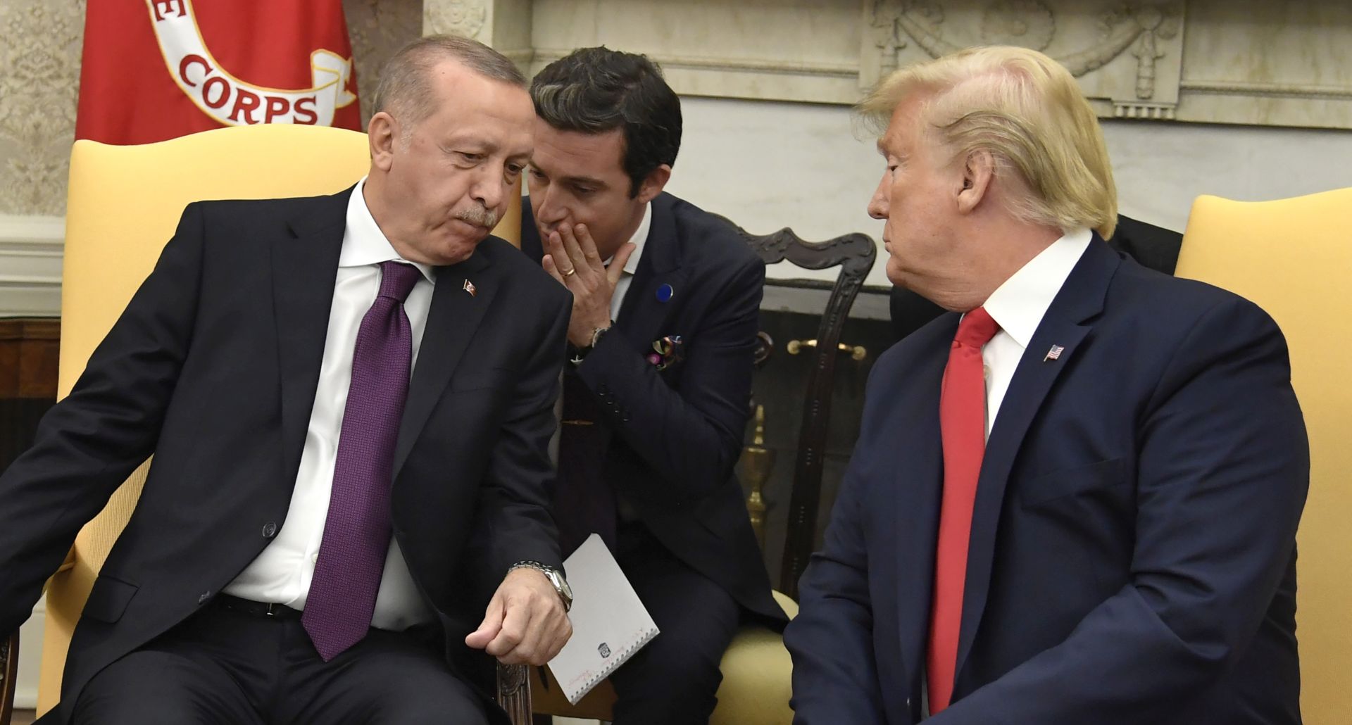 epa07993655 President Donald Trump (R) leans in as a translator speaks to Turkish President Recep Tayyip Erdogan in the Oval Office of the White House, Wednesday, November 13, 2019, Washington, DC, USA, 13 November 2019. The leaders are expected to discuss security issues, trade, NATO and Turkey's incurson into Syria.  EPA/MIKE THEILER / POOL