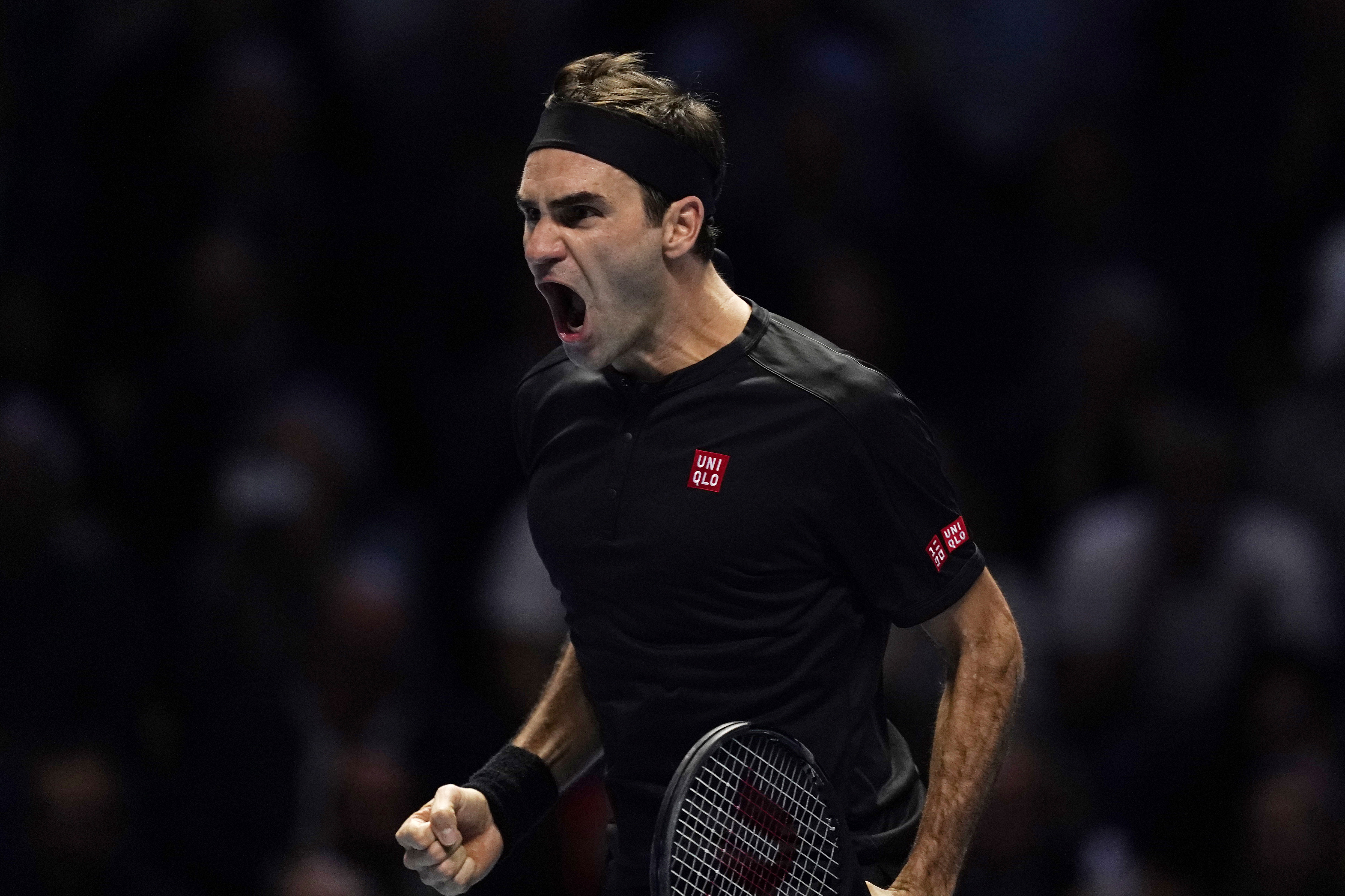 epa07997102 Roger Federer of Switzerland reacts after winning his round robing match against Novak Djokovic of Serbia at the ATP World Tour Finals tennis tournament in London, Britain, 14 November 2019.  EPA/WILL OLIVER