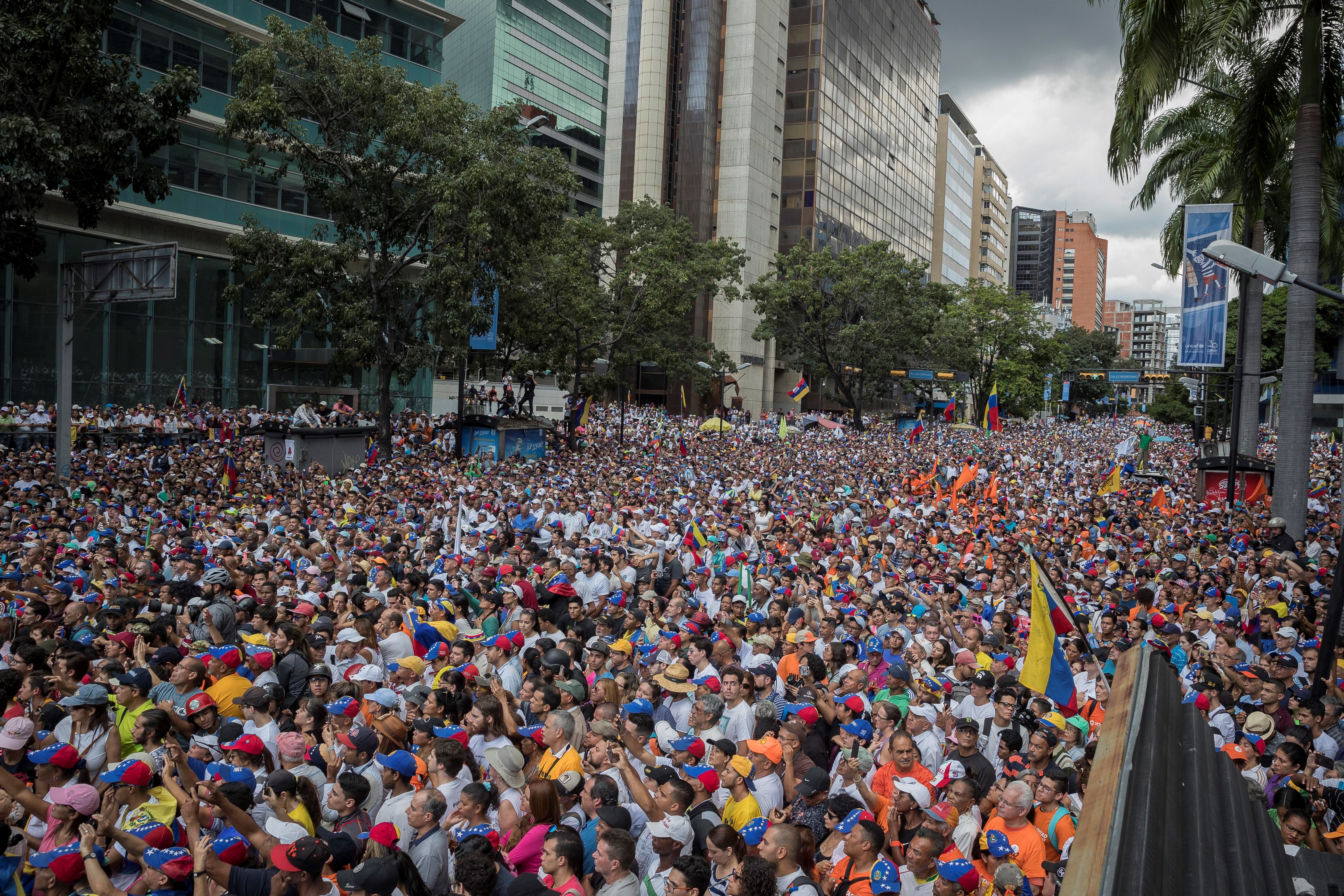 epa08002182 Opponents of the government of Nicolas Maduro march in Caracas, Venezuela, 16 November 2019. The opposition call was announced a month ago and during the last few weeks the political forces opposed to Chavism have been encouraging the population to participate in this demonstration. Guaido, recognized as president in charge of Venezuela by almost 60 countries, leads the movement and in recent hours has intensified his calls to the street after a student protest that was repressed with tear gas in Caracas.  EPA/Rayner Pena