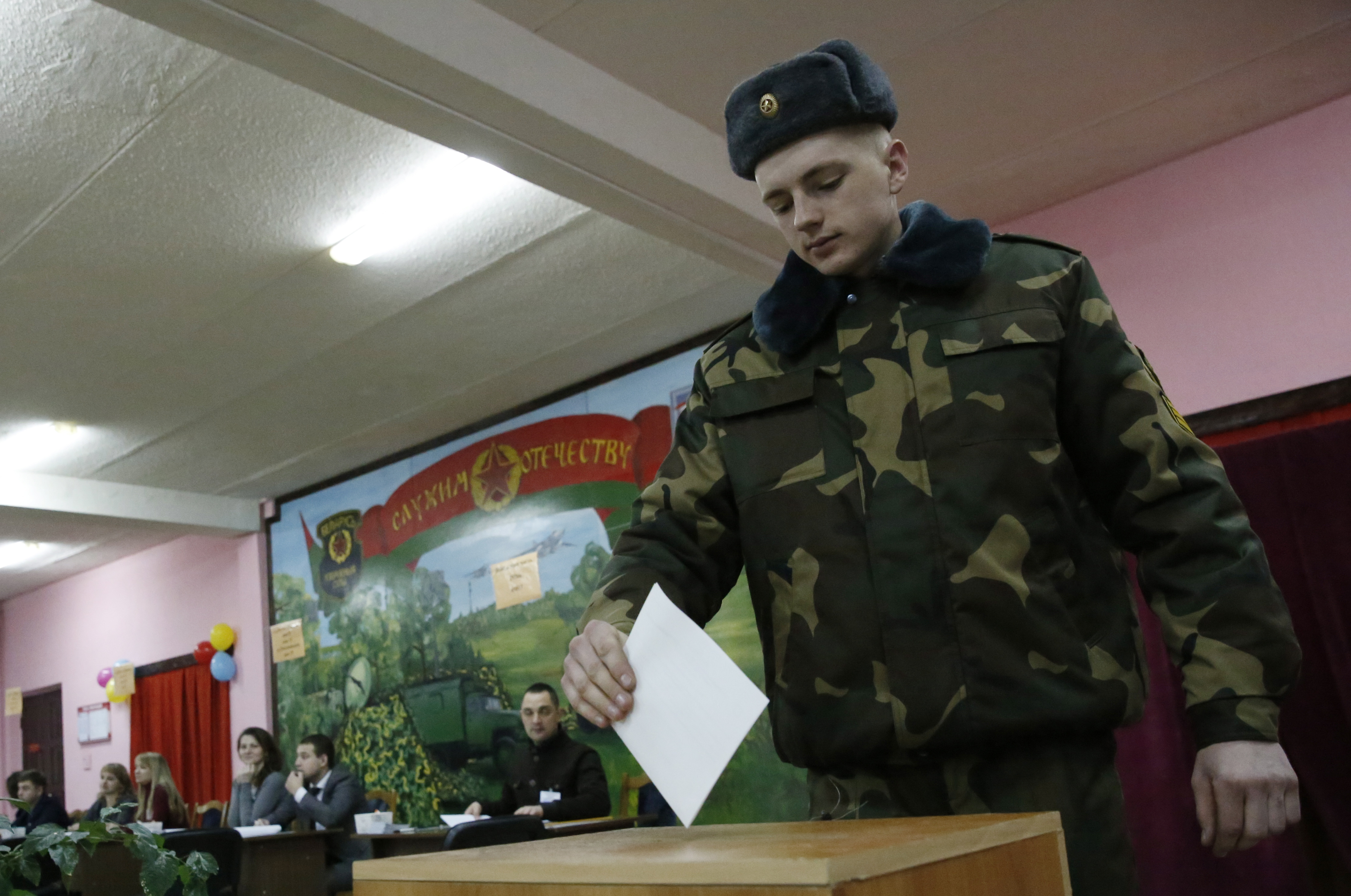 epa08003040 A Belarusian soldier casts his ballot at a polling station during parliamentary elections, in Minsk, Belarus, 17 November 2019. The elections are being closely watched by the West to see how much leeway country's President Alexander Lukashenko, who has been in power for 25 years, is willing to give to opposition candidates. Around 300 opposition candidates are running in the election.  EPA/TATYANA ZENKOVICH