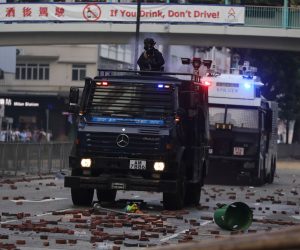epa08005230 Police vehicles move in on pro-democracy protesters (not pictured) during clashes outside the Hong Kong Polytechnic University (PolyU), in Hong Kong, China, 18 November 2019. Hong Kong is in its sixth month of mass protests, which were originally triggered by a now withdrawn extradition bill and have since turned into a wider pro-democracy movement.  EPA/FAZRY ISMAIL