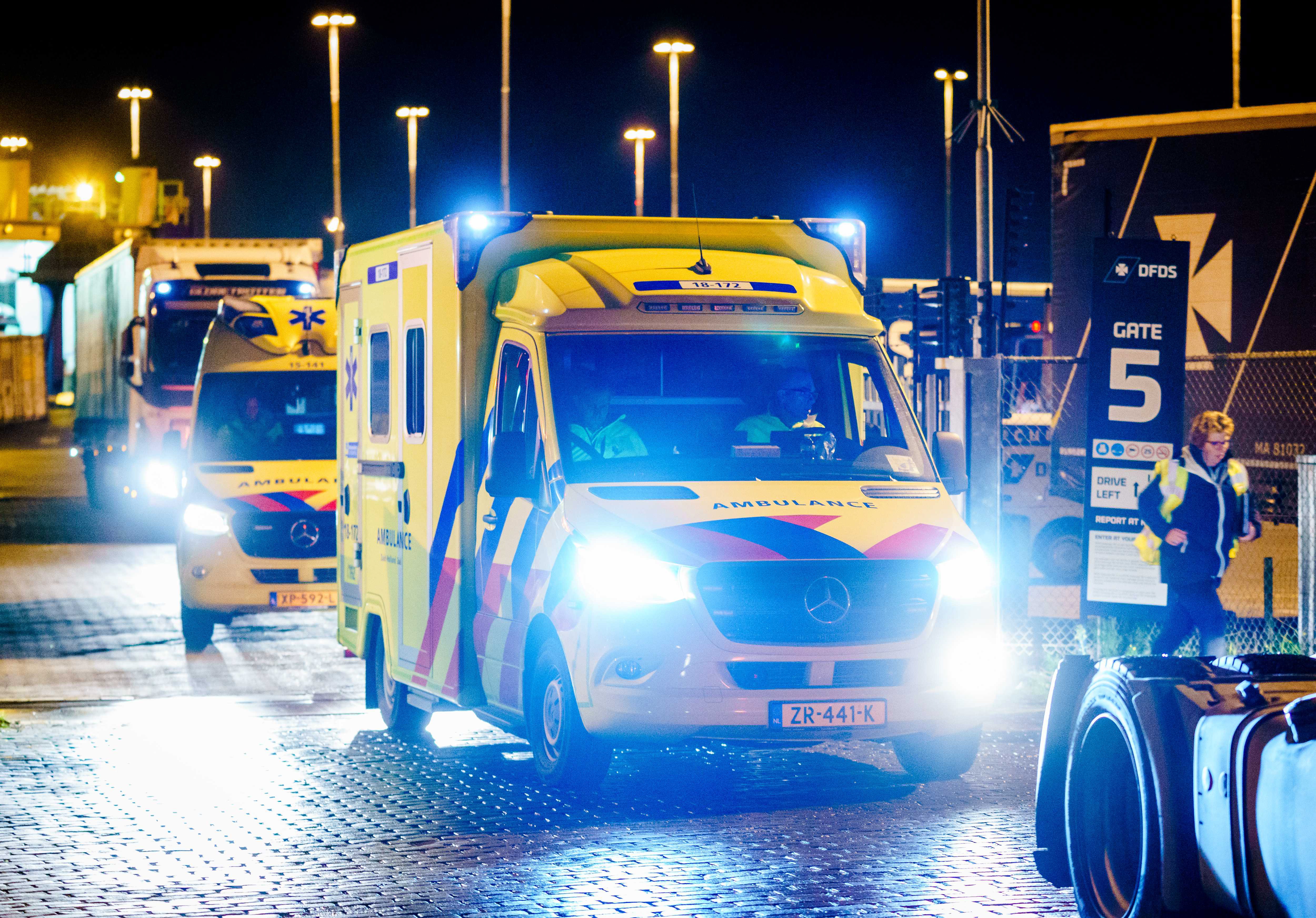 epa08009761 Emergency services at the Vulcaanhaven where 25 stowaways were found in DFDS ferry in the harbor of Vlaardingen, The Netherlands, 19 November 2019. According to reports, at least 26 stowaways were found in a refrigerated container on a ferry en route to the UK. The Britannia Seaways ferry has returned after the people had been found.  EPA/MARCO DE SWART