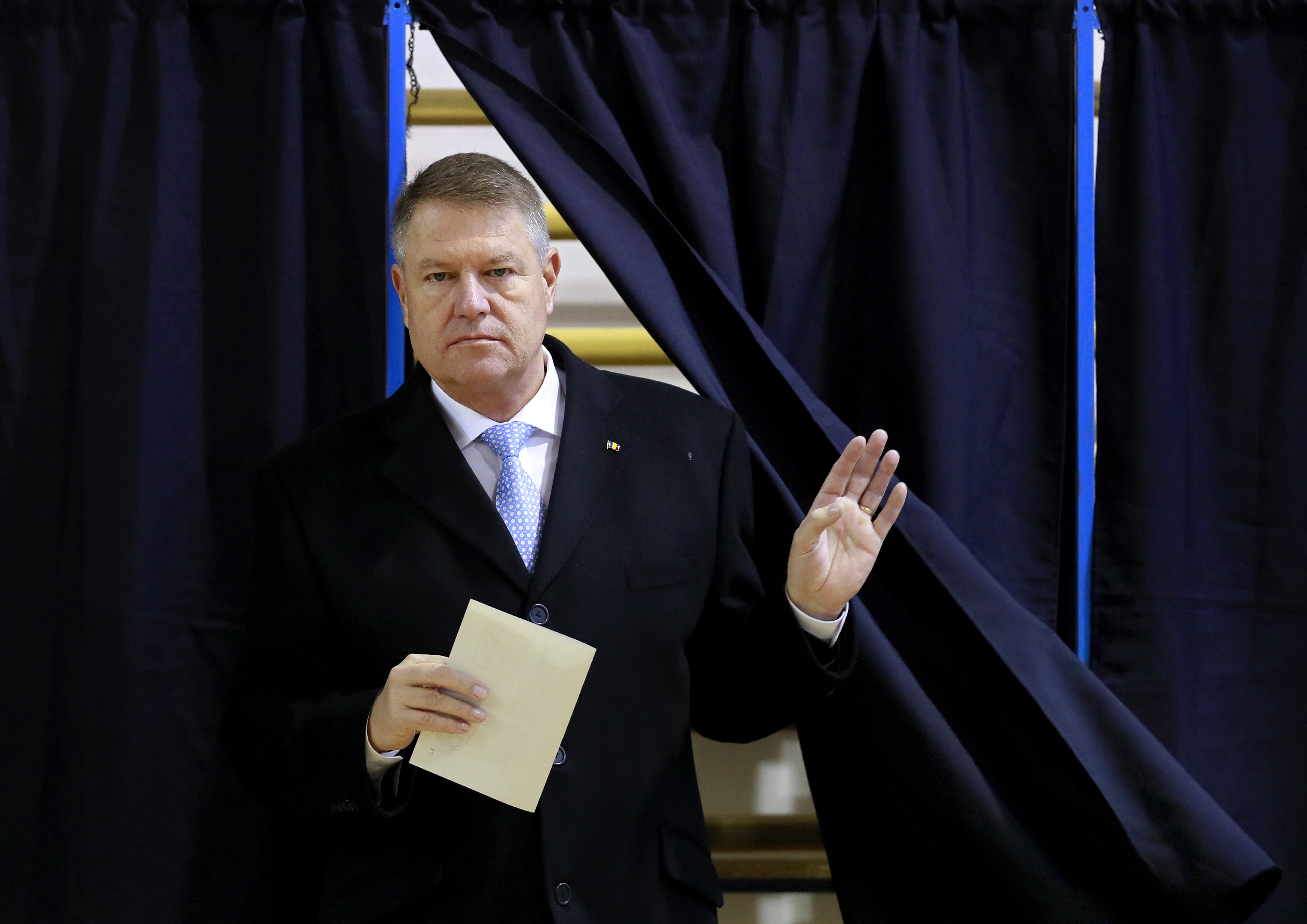 epa08021416 Romanian President Klaus Iohannis exits the voting booth to cast his ballot at a polling station during the presidential elections runoff in Bucharest, Romania, 24 November 2019. Iohannis is running for a second mandate, facing former prime minister Viorica Dancila in the second round of presidential elections.  EPA/ROBERT GHEMENT
